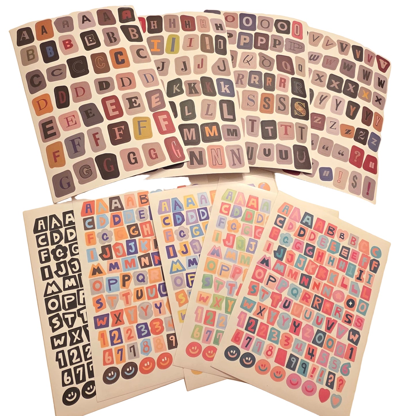 Collection of alphabet and number stickers on a beige background