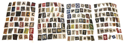 Collection of vintage-style letter tiles on a white background